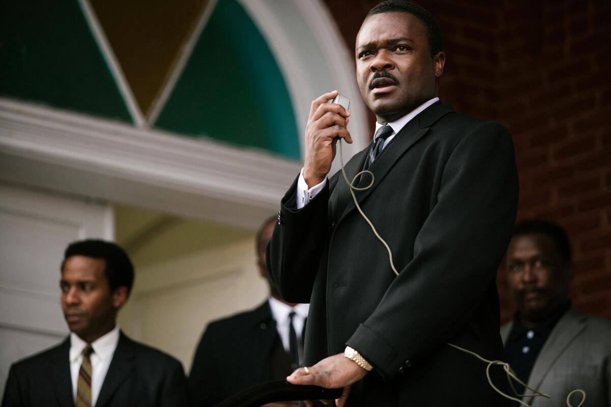 A man gives a speech on a podium.