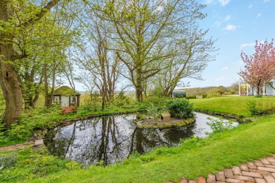 Pond and garden at a country estate.