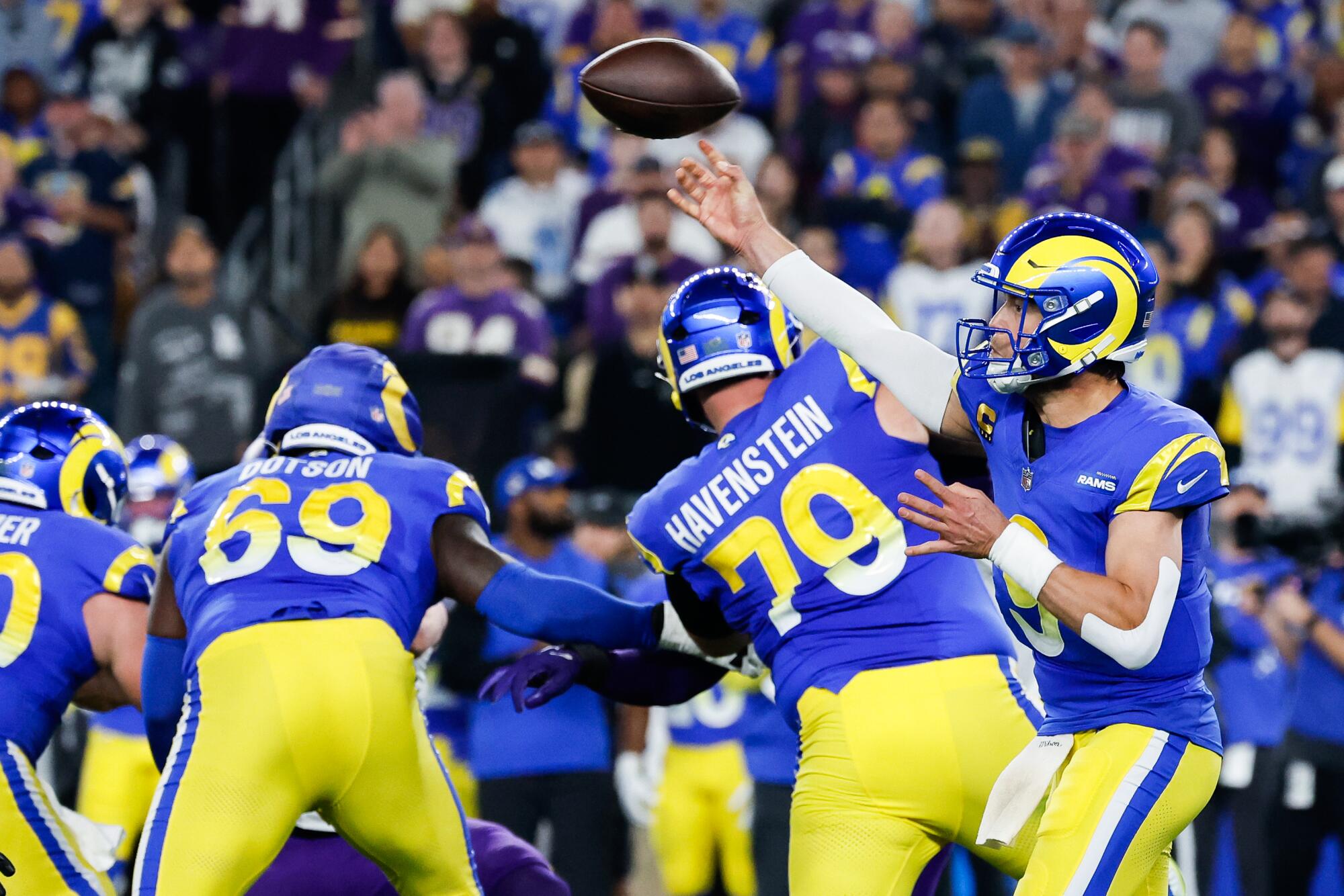 Rams quarterback Matthew Stafford throws a pass against the Vikings at State Farm Stadium.