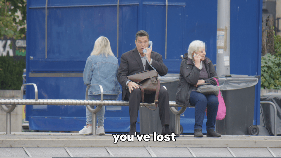 Man on phone, sitting on bench with two other people. "You've lost" text overlay.