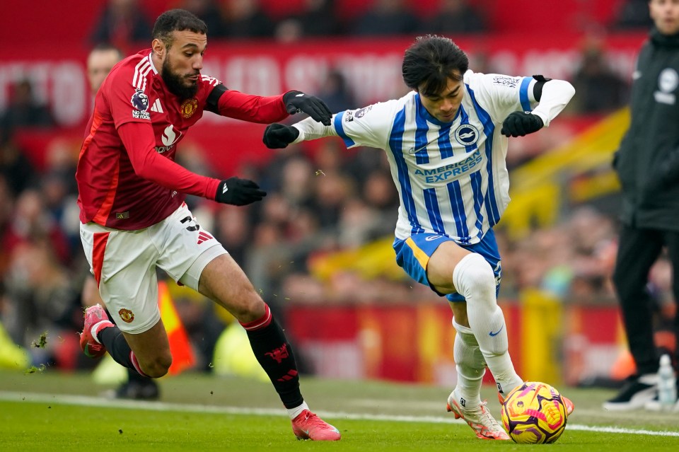 Manchester United's Noussair Mazraoui and Brighton's Kaoru Mitoma vying for the ball.