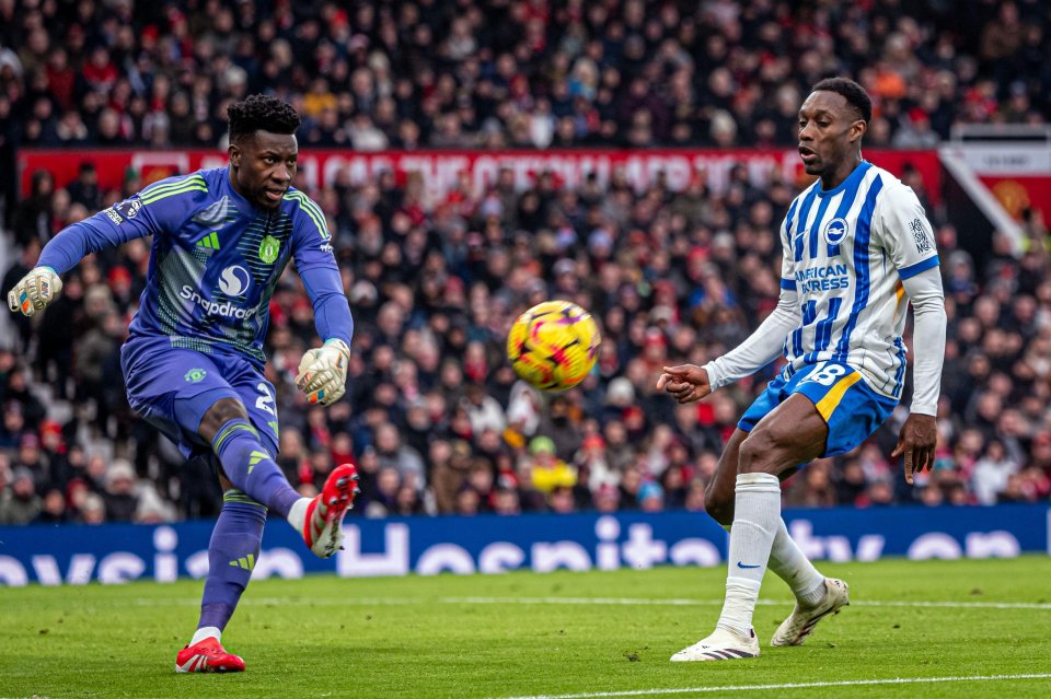 Andre Onana of Manchester United and Danny Welbeck of Brighton during a Premier League football match.