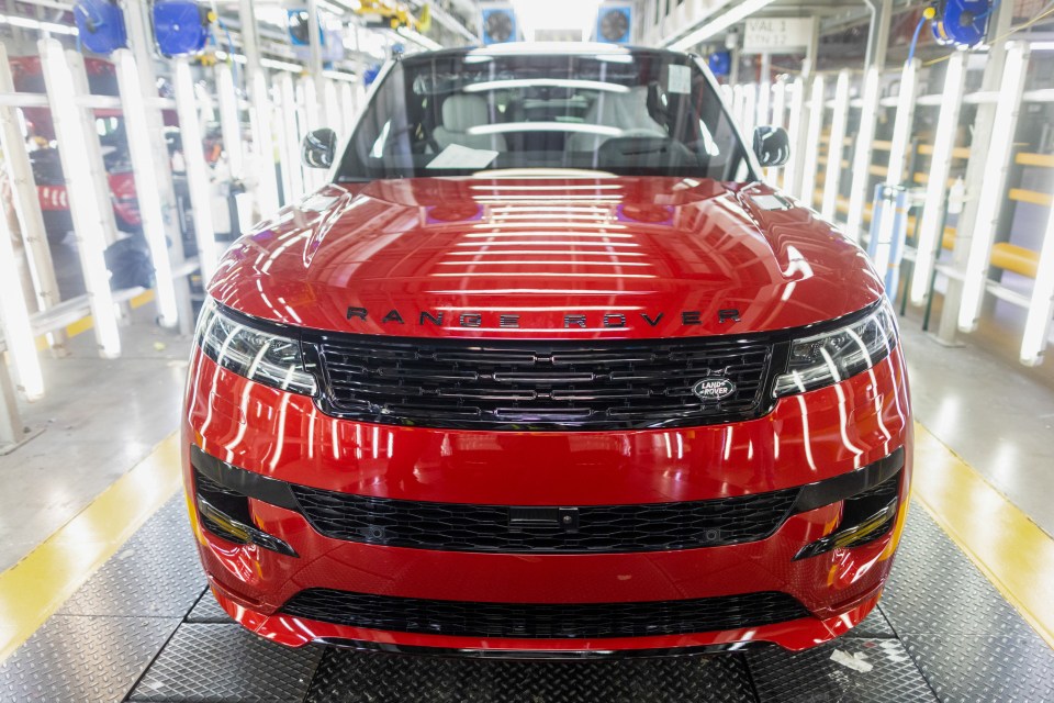 Red Range Rover Sport at the end of a production line.