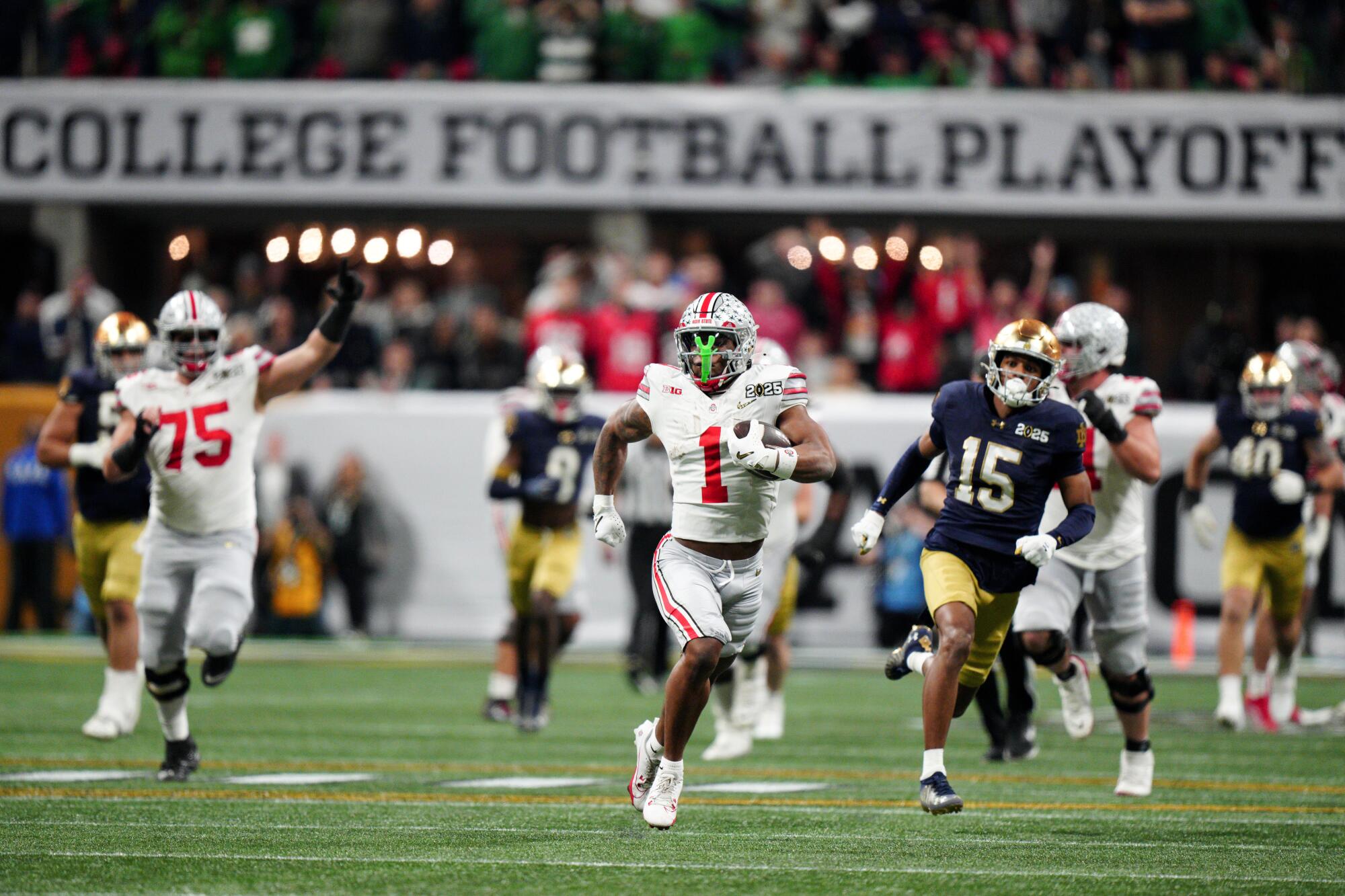 Ohio State running back Quinshon Judkins carries the ball against Notre Dame in the second half.