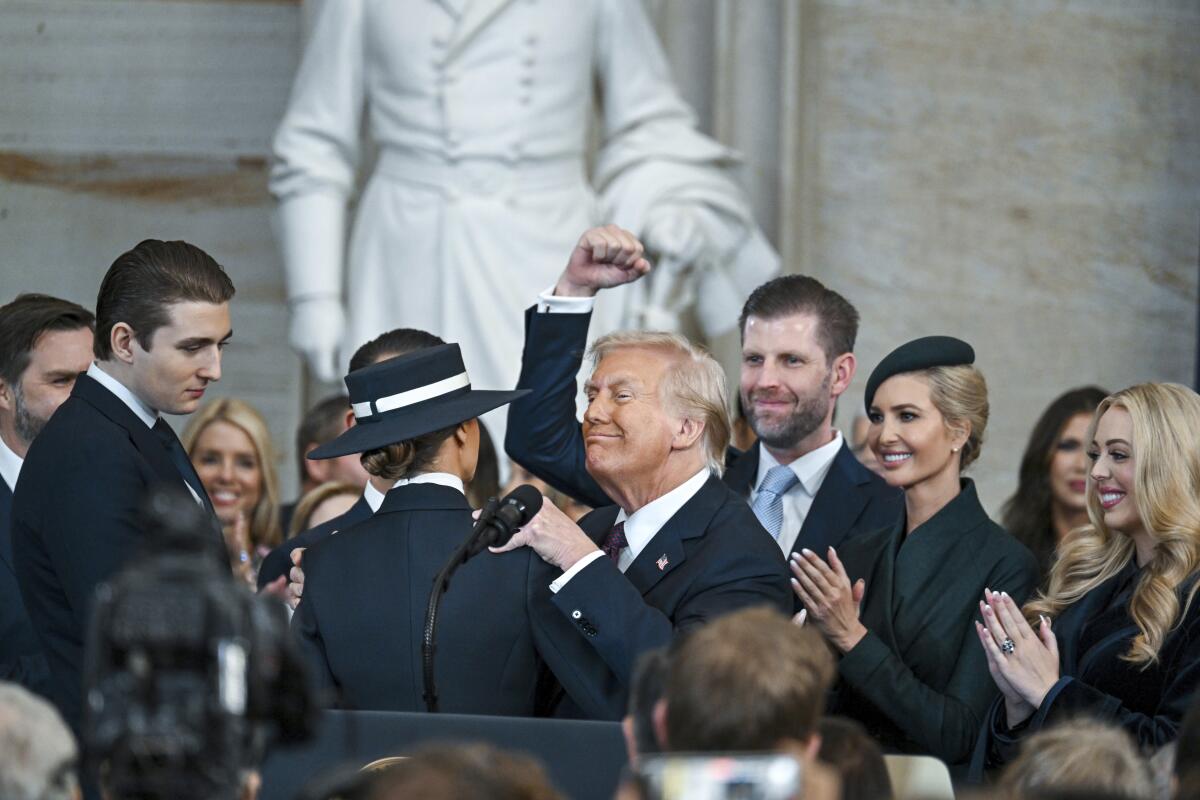 President Trump celebrates with his family after being sworn in.