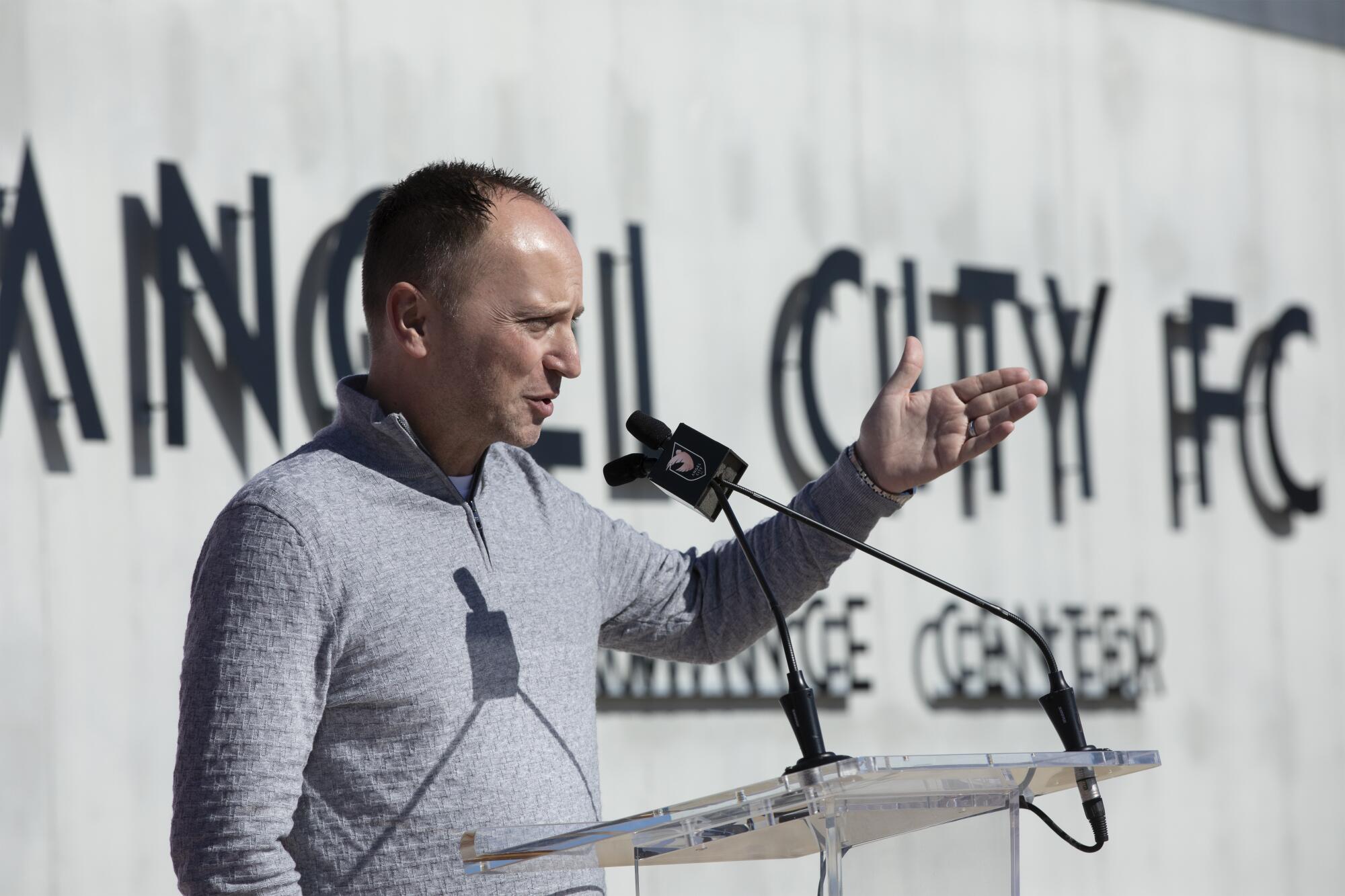 Angel City FC general manager Mark Parsons gestures with his left hand as he addresses reporters Tuesday.