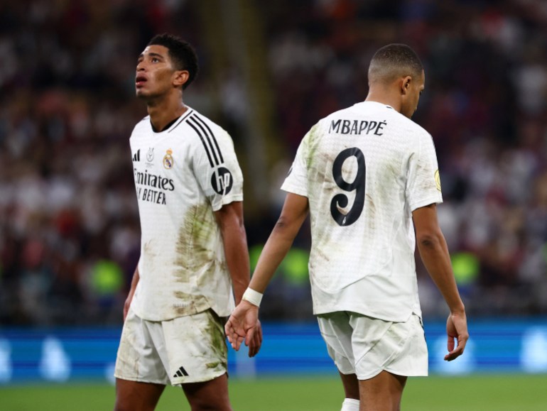 Soccer Football - Spanish Super Cup - Final - FC Barcelona v Real Madrid - King Abdullah Sports City, Jeddah, Saudi Arabia - January 12, 2025 Real Madrid's Kylian Mbappe and Jude Bellingham look dejected at the end of the match REUTERS/Pedro Nunes