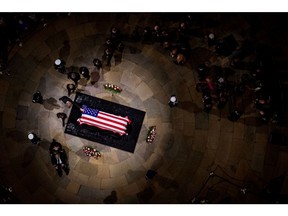 A relative of the late Jimmy Carter pays respects at his casket in the Rotunda of the US Capitol in Washington on Jan. 7.