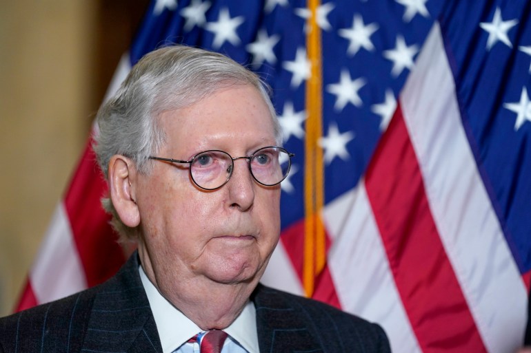 Mitch McConnell in front of a US flag