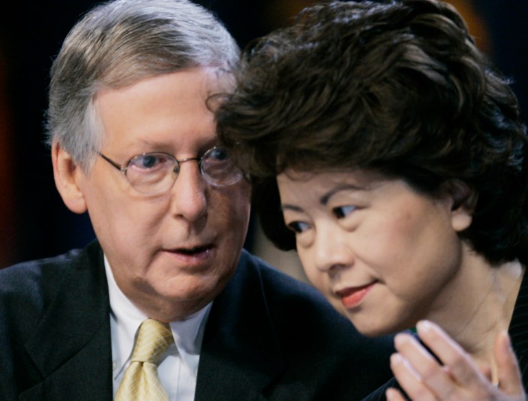 Mitch McConnell speaks to his wife Elaine Chao