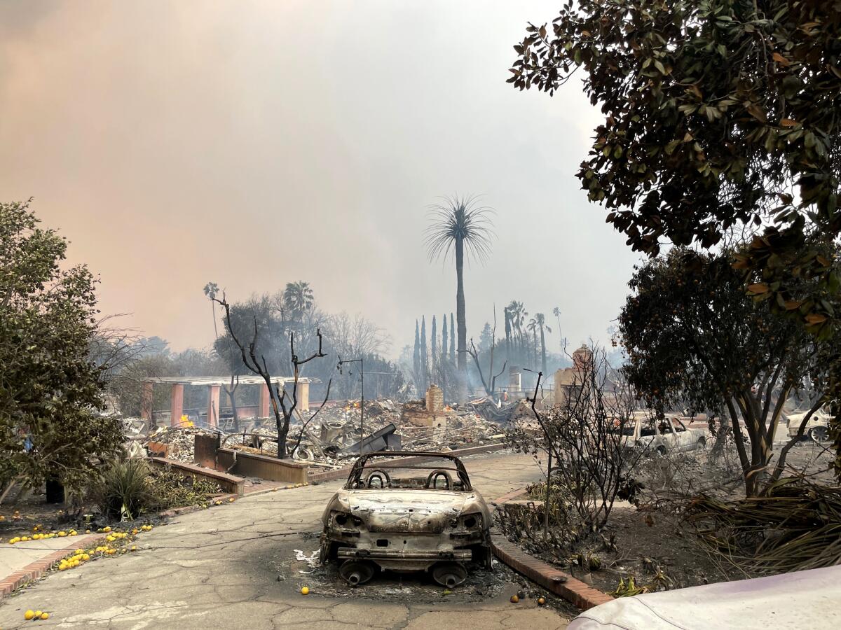 The remains of the home base for the artist collective known as John Joyce University in Altadena after the Eaton fire.