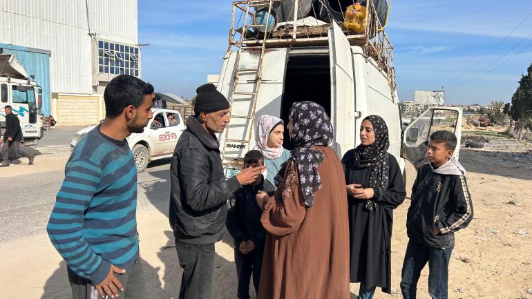 Alwan's family discussing what to do next, whether to return to their life of displacement in Al-Mawasi, or life amidst the ruins of their Rafah home