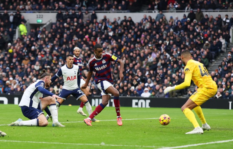 LONDON, ENGLAND - JANUARY 04: Alexander Isak of Newcastle United scores his team's second goal past Brandon Austin of Tottenham Hotspur during the Premier League match between Tottenham Hotspur FC and Newcastle United FC at Tottenham Hotspur Stadium on January 04, 2025 in London, England. (Photo by Alex Pantling/Getty Images)