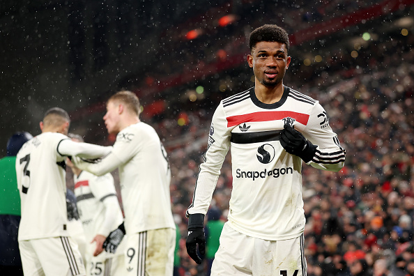 LIVERPOOL, ENGLAND - JANUARY 05: Amad Diallo of Manchester United celebrates scoring his team's second goal during the Premier League match between Liverpool FC and Manchester United FC at Anfield on January 05, 2025 in Liverpool, England. (Photo by Carl Recine/Getty Images)