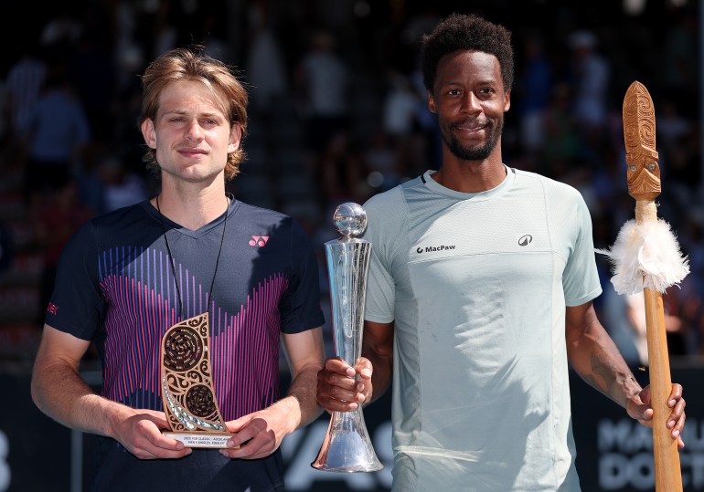 AUCKLAND, NEW ZEALAND - JANUARY 11: Zizou Bergs of Belgium (L) and Gael Monfils of France (R) pose with their trophies following their Mens Singles Final on Day 13 of the ASB Classic at the ASB Tennis Centre on January 11, 2025 in Auckland, New Zealand. (Photo by Phil Walter/Getty Images)