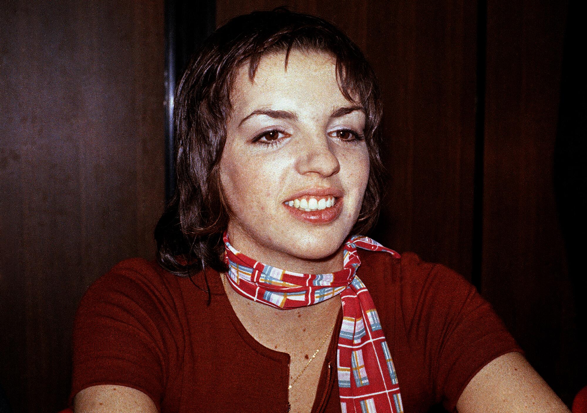 A performer smiles at a film festival.