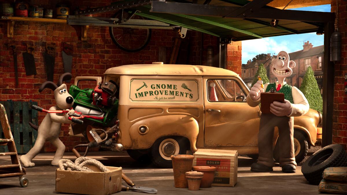 A clay-animation man and dog in a garage next to a vehicle that says Gnome Improvements.