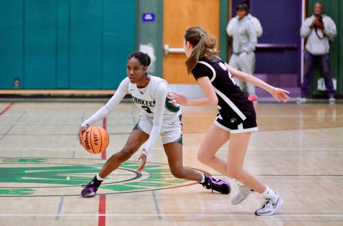 Hamilton High's Jade Fort brings the ball up court during a game against Palisades.