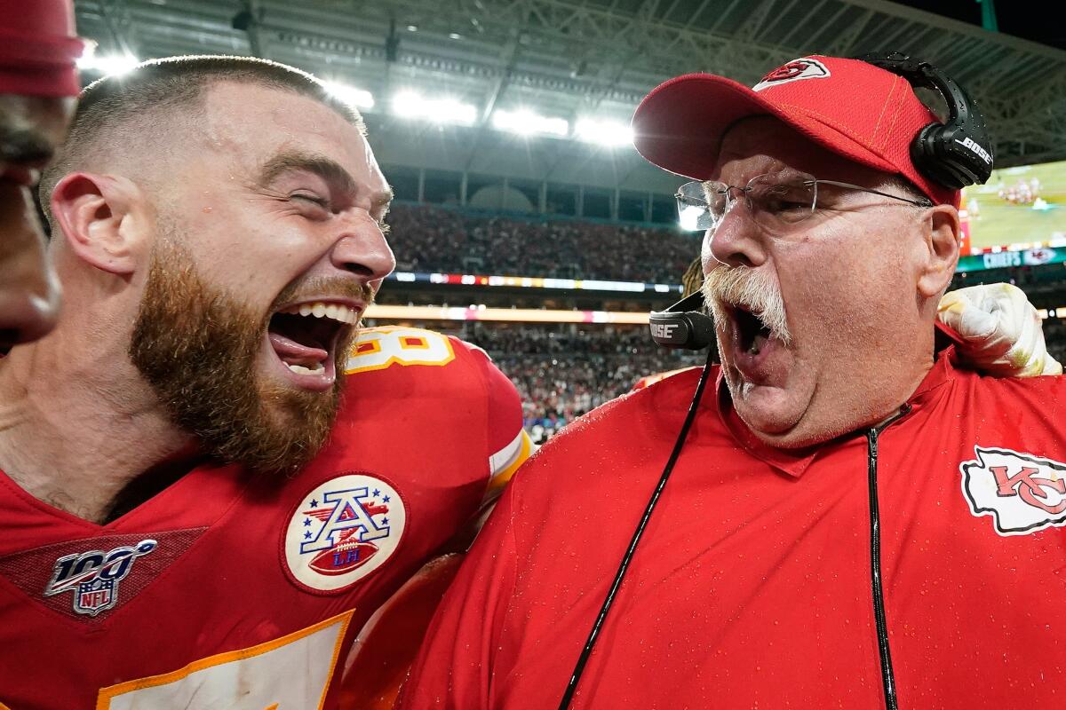 A close-up of Kansas City Chiefs tight end Travis Kelce celebrating his Super Bowl 54 win with coach Andy Reid