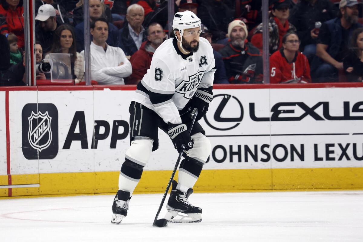 Kings' Drew Doughty looks to pass the puck against the Carolina Hurricanes 