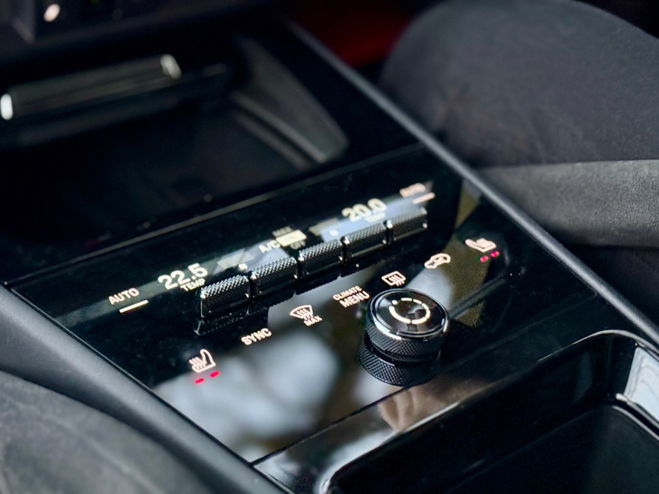 Porsche Cayenne climate control panel.