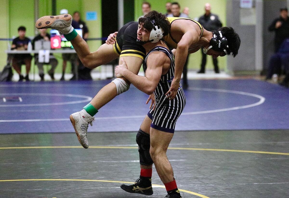 Birmingham’s Arno Vardanyan body slams San Fernando’s Jorge Palacios in the 126-pound final on Saturday.