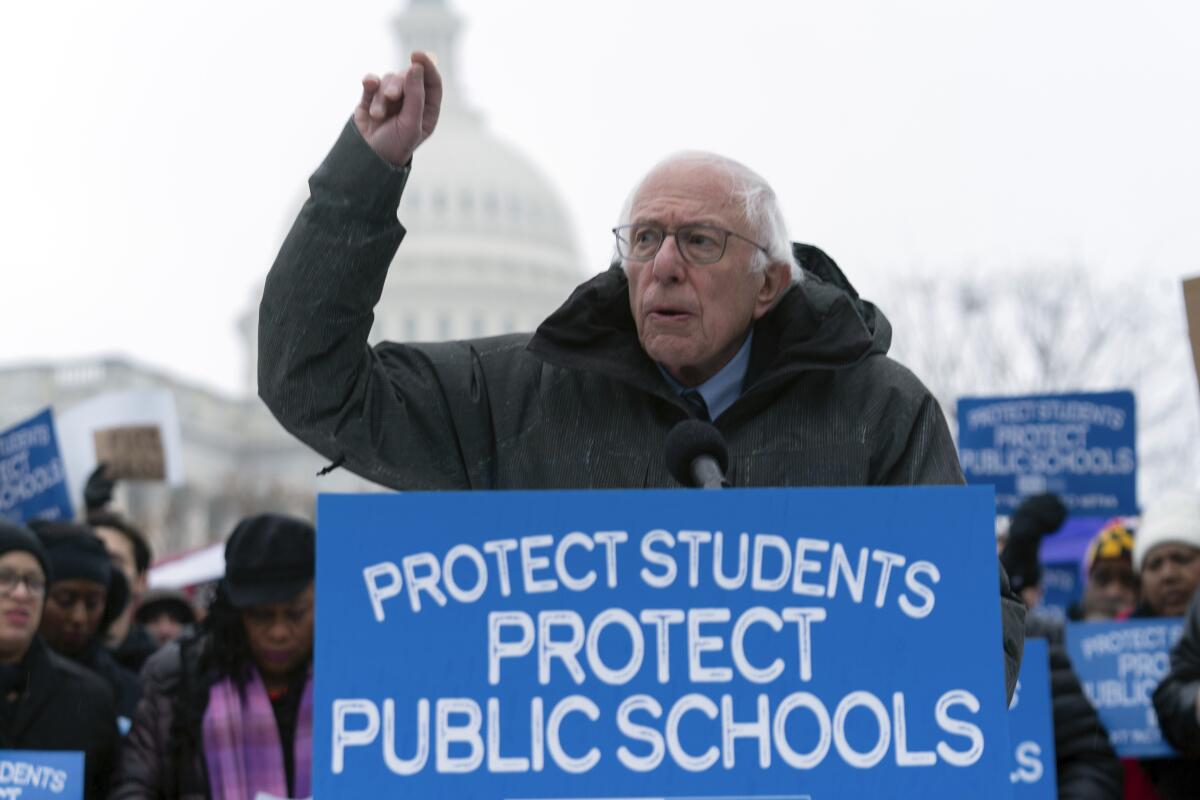 Sen. Bernie Sanders (I-Vt.) protests against the policies of President Trump and Elon Musk at the U.S. Capitol.