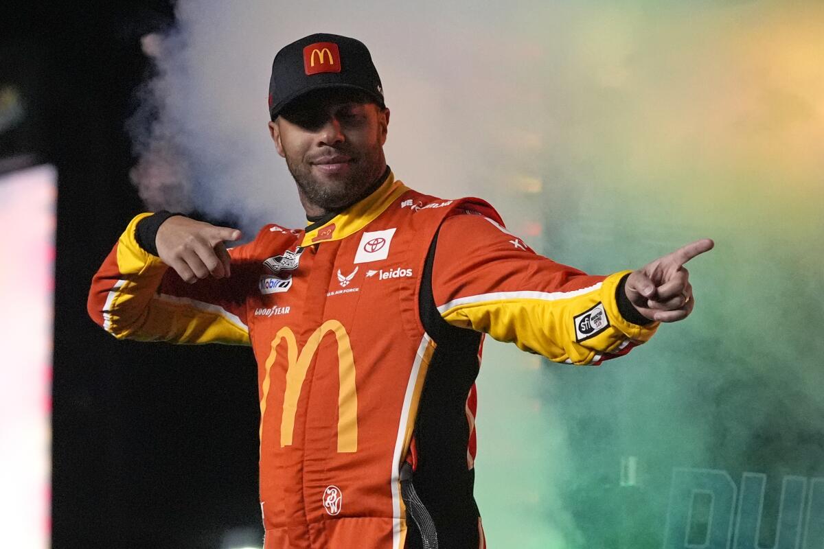 Bubba Wallace points during driver introductions.