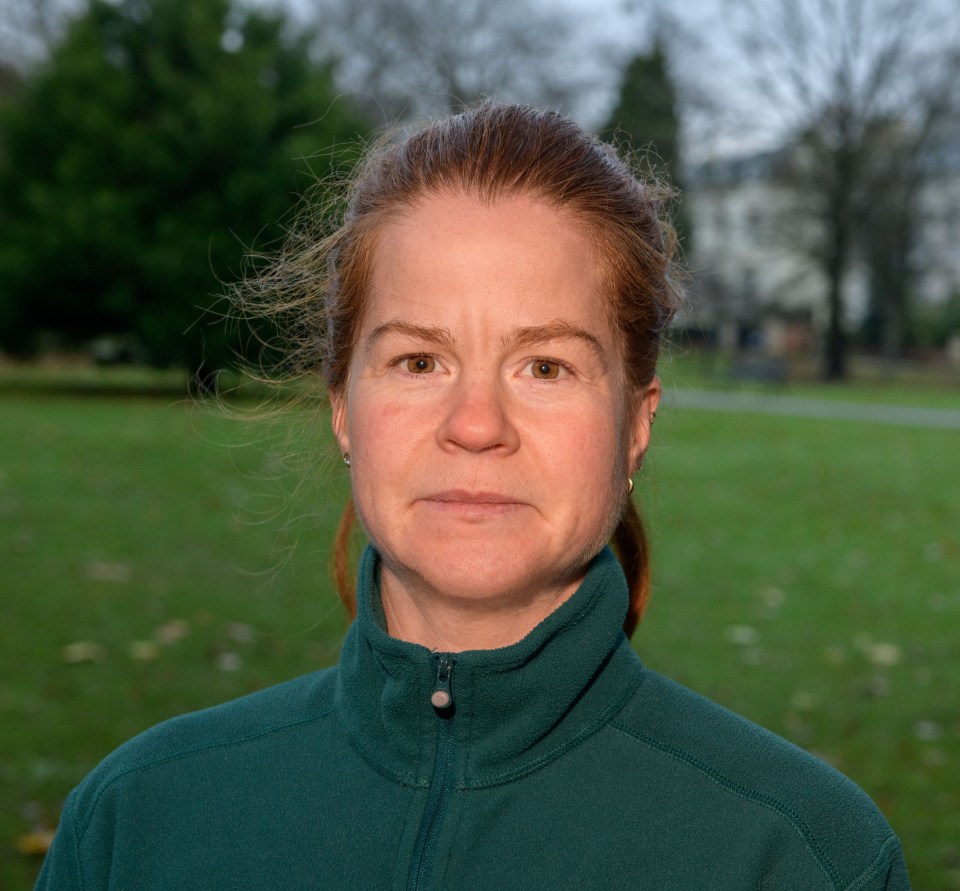 Portrait of a woman in a green fleece jacket.