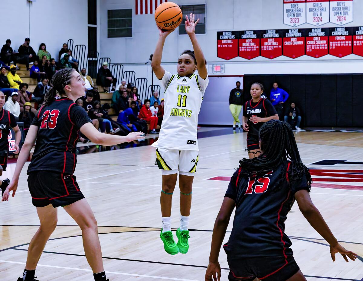 Sophomore Kaleena Smith of Ontario Christian launches a shot against Etiwada defenders from a November game.