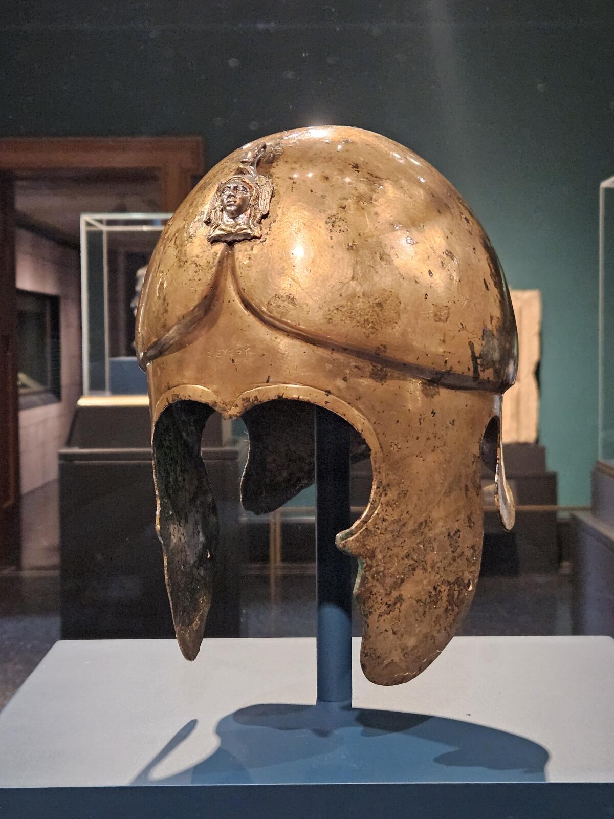 A late 4th century BC Thracian helmet features a silver applique of warrior goddess Athena.