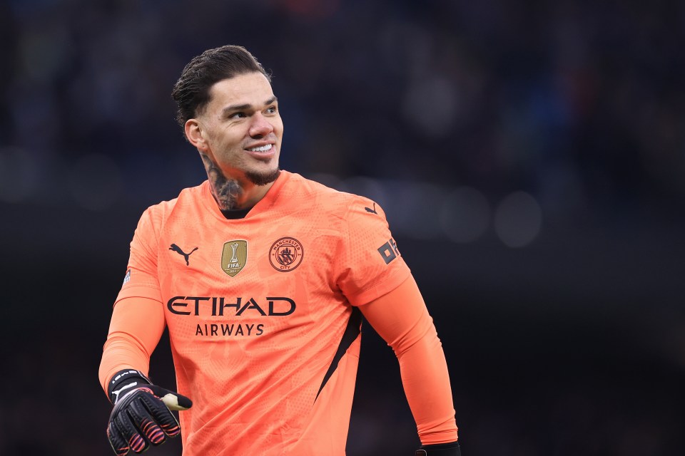 Manchester City goalkeeper Ederson smiling.