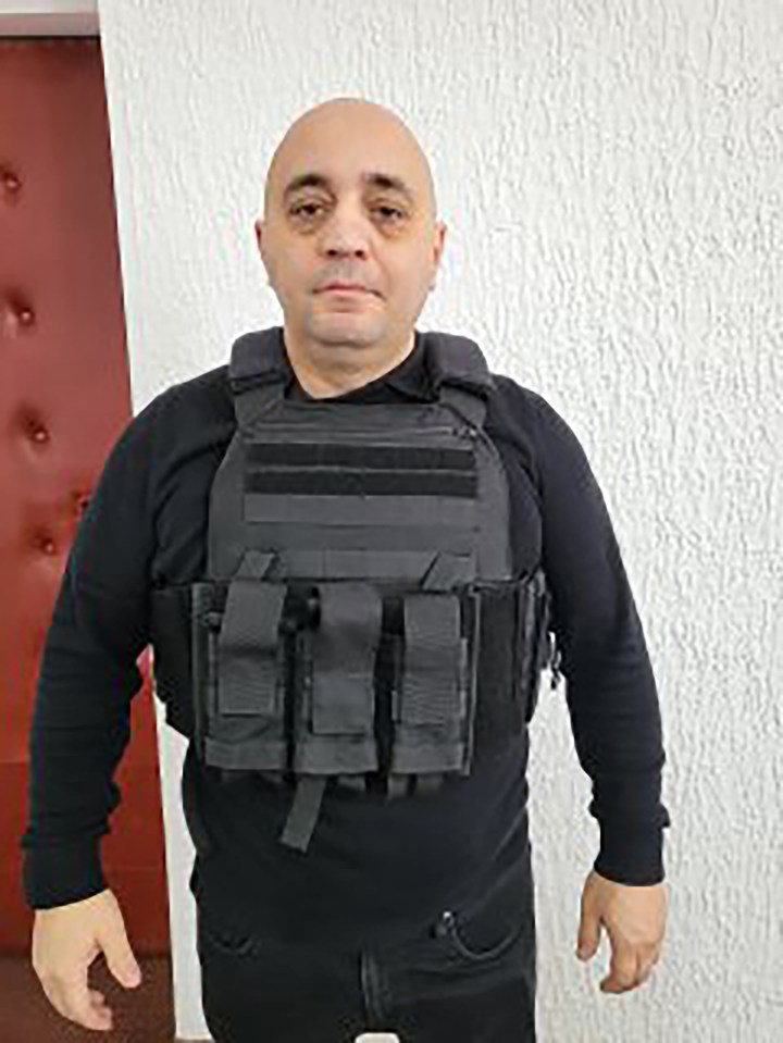 Man wearing a tactical vest.