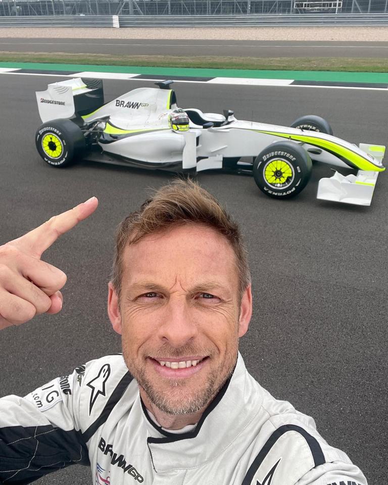 Jenson Button with his championship-winning Brawn GP F1 car.