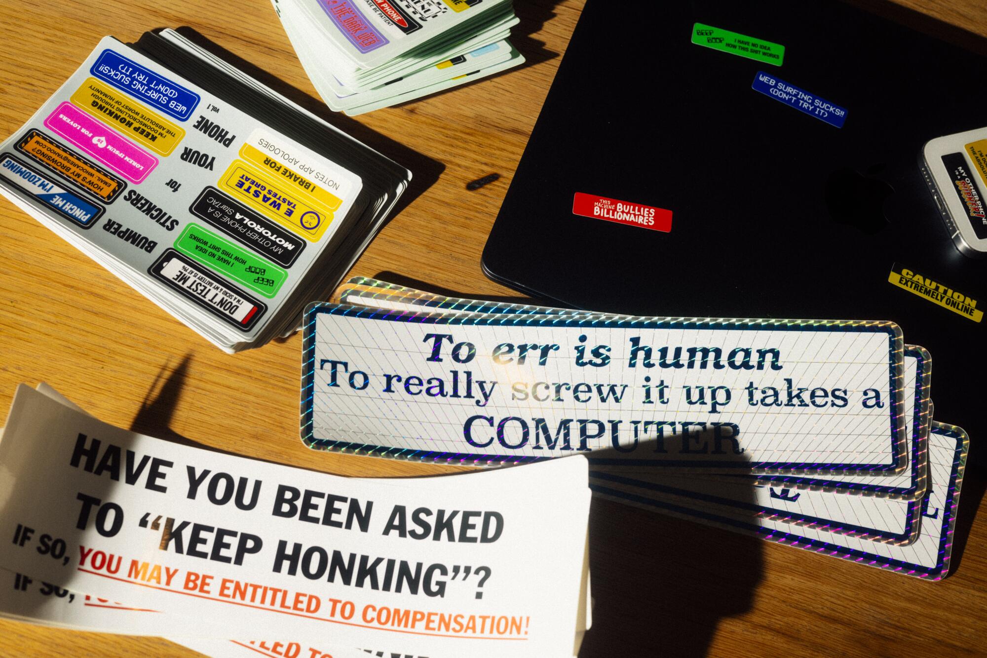 Bumper stickers on a desk.