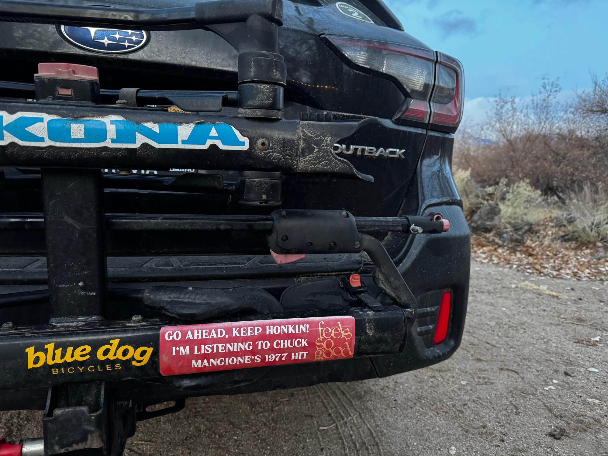 A bumper sticker on a car.