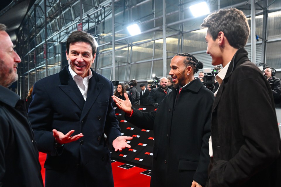 Toto Wolff, Lewis Hamilton, and George Russell at an event.