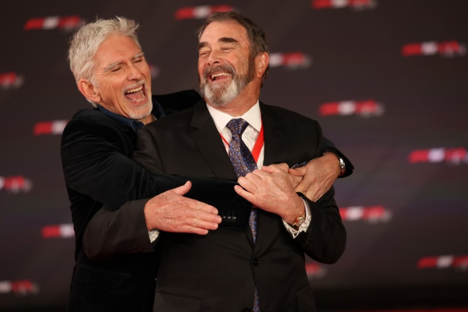 epa11905740 (L-R) Former British racing drivers Damon Hill and Nigel Mansell embrace ahead of the Formula One season launch event to mark the start of the sports 75th anniversary year at the O2 Arena in London, Britain, 18 February 2025. EPA/NEIL HALL