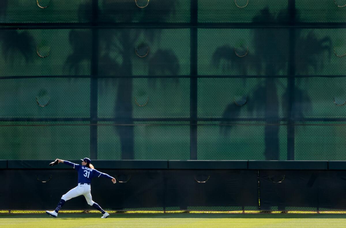 Dodgers pitcher Tyler Glasnow warms-up in center field during spring training