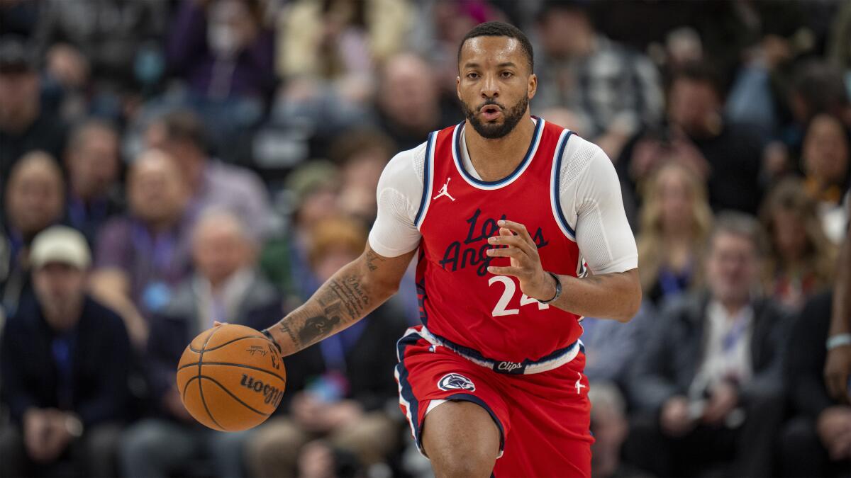 Clippers guard Norman Powell brings the ball up court during a game in Salt Lake City.