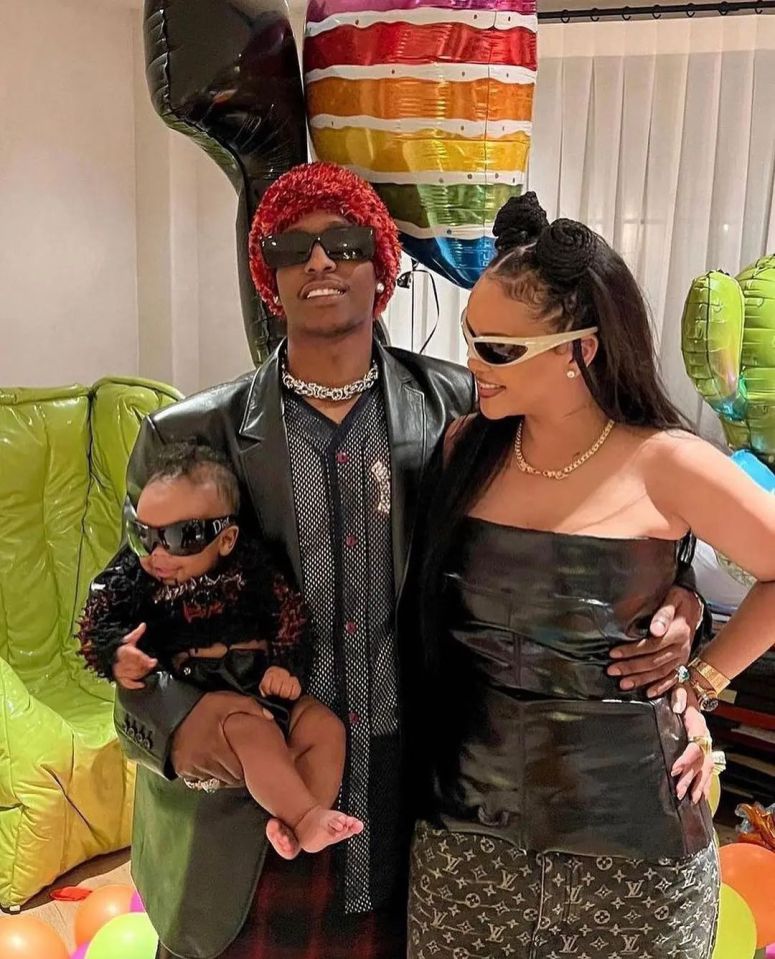 Rihanna, A$AP Rocky, and their baby at a party.