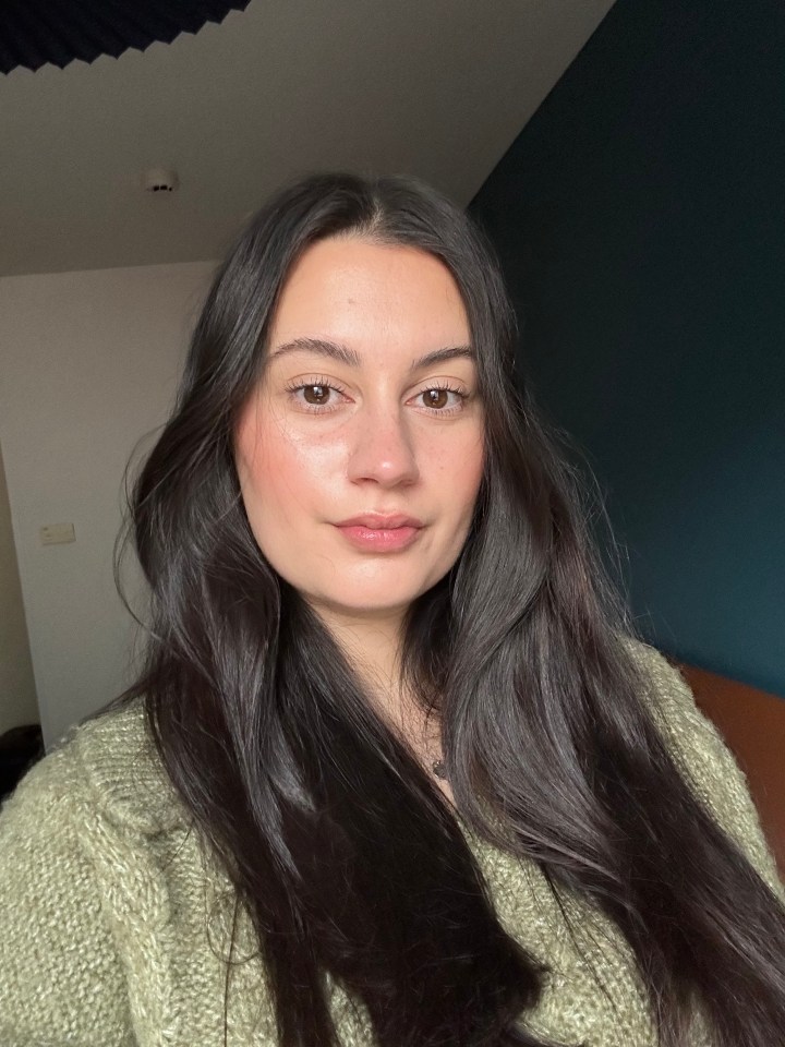 Portrait of a woman with long dark hair.