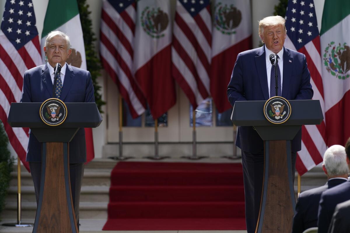 Then-Mexican President Andrés Manuel López Obrador and President Trump at lecterns in front of American and Mexican flags