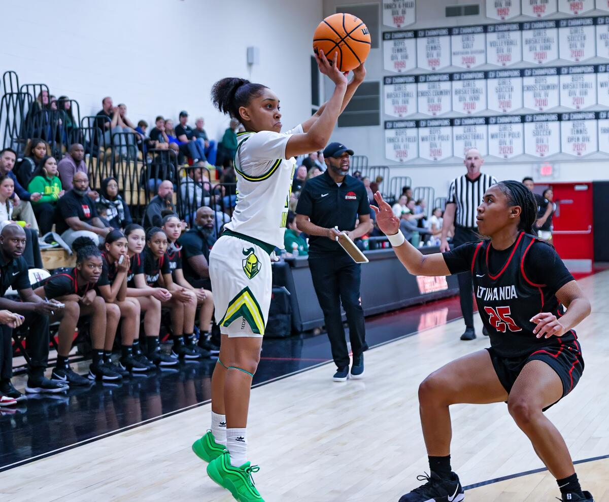 Sophomore Kaleena Smith takes baseline shot against Etiwanda.