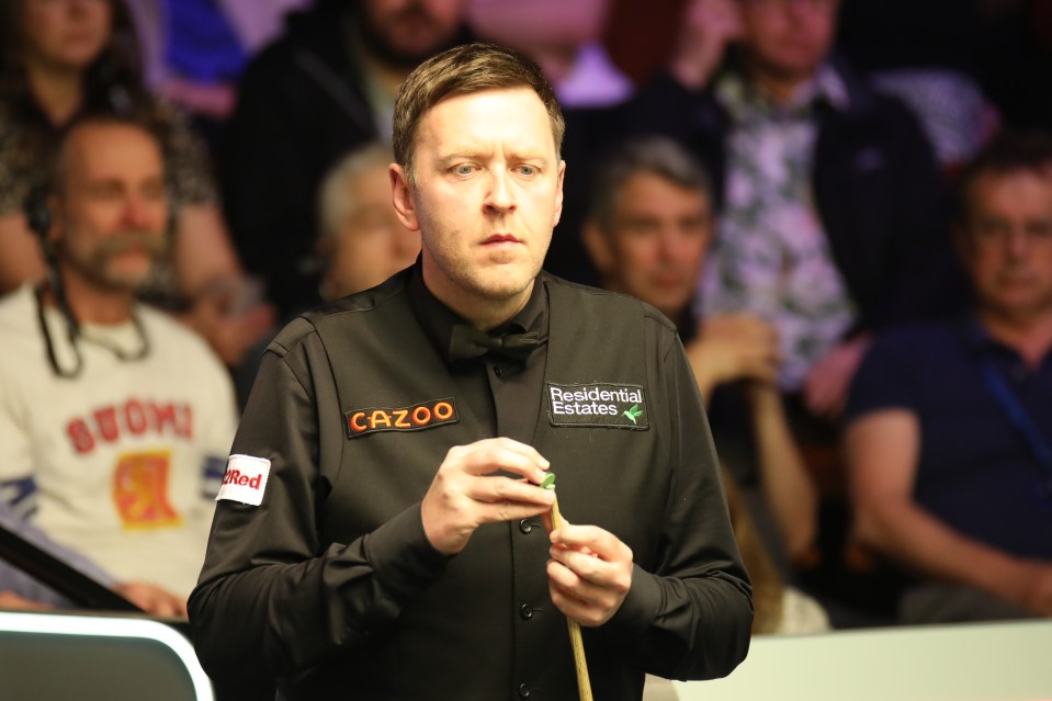 Ricky Walden chalking his cue at the World Snooker Championship.