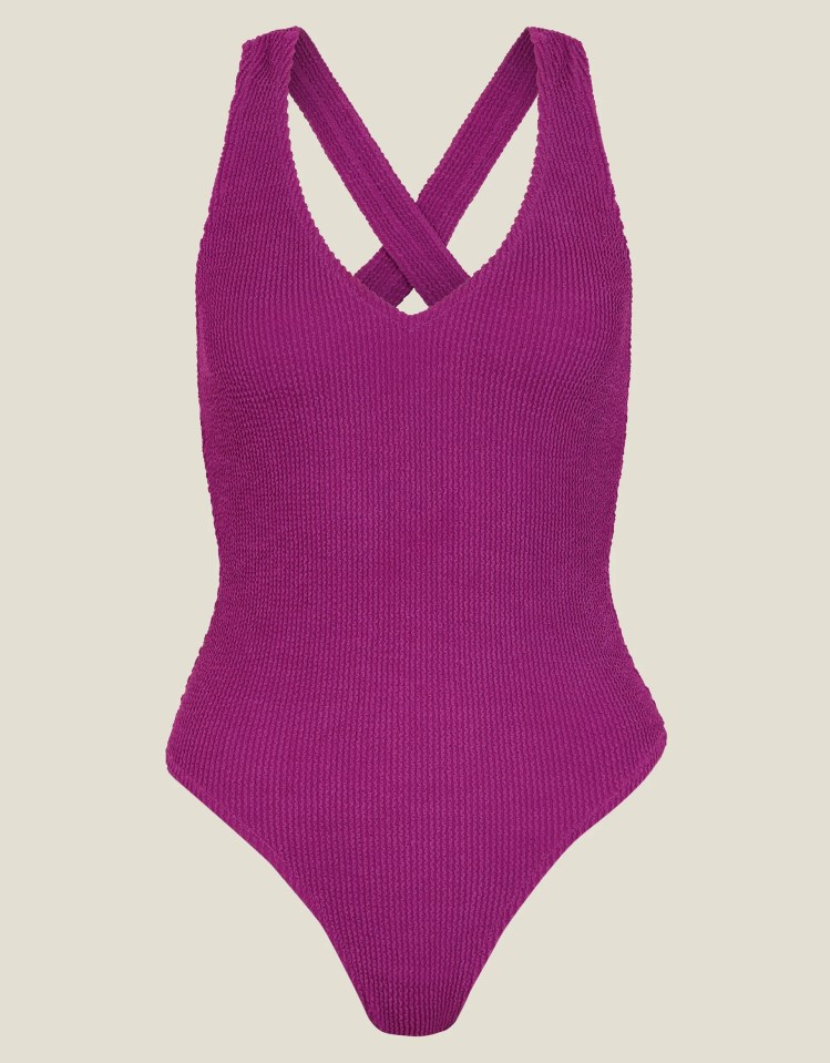 Purple crinkle swimsuit with crisscross straps.