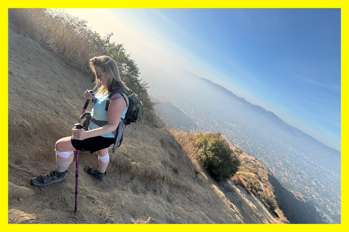 A hiker pauses on the route to Mt. Thom.