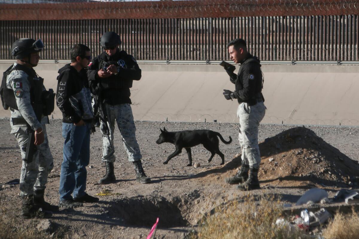 Members of the Mexican National Guard stand near the entrance to an alleged drug tunnel.