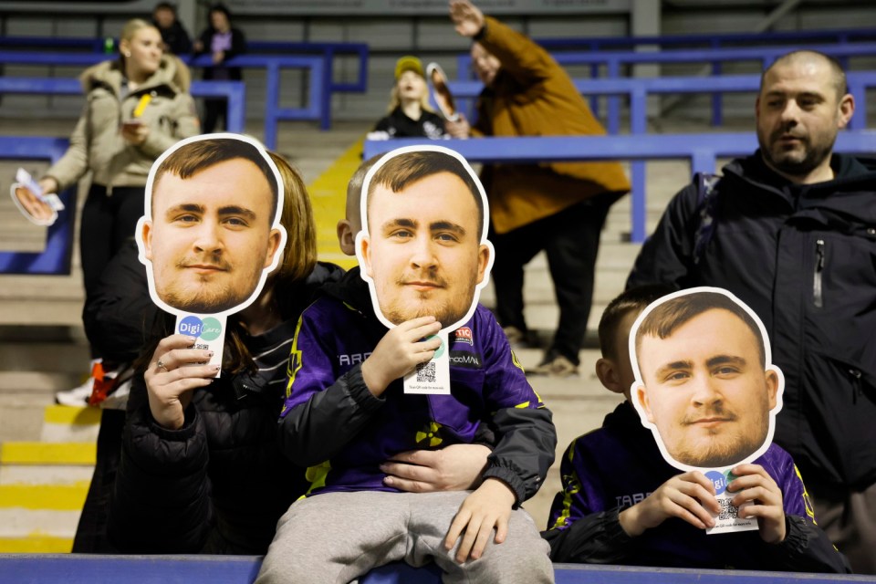 Young fans with Luke Littler masks before the Betfred Super League match at the Halliwell Jones Stadium, Warrington. Picture date: Friday February 21, 2025. PA Photo. See PA story RUGBYL Warrington. Photo credit should read: Richard Sellers/PA Wire. RESTRICTIONS: Use subject to restrictions. Editorial use only, no commercial use without prior consent from rights holder.