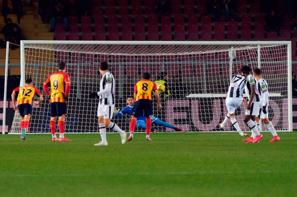 Soccer player taking a penalty kick.